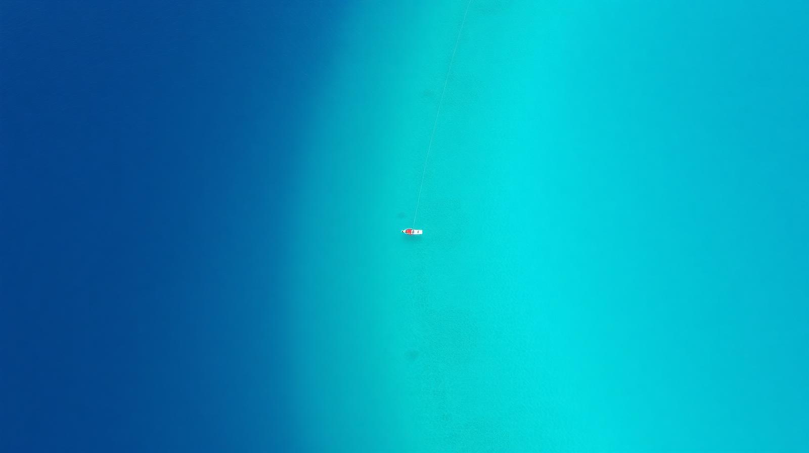 Aerial view of a freediving line buoy in a turquoise lagoon